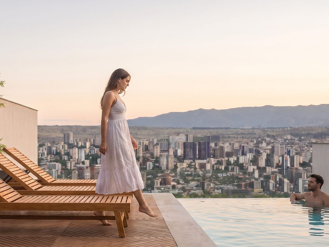Infinity pool over the Tbilisi skyline at sunset, Sky Villas