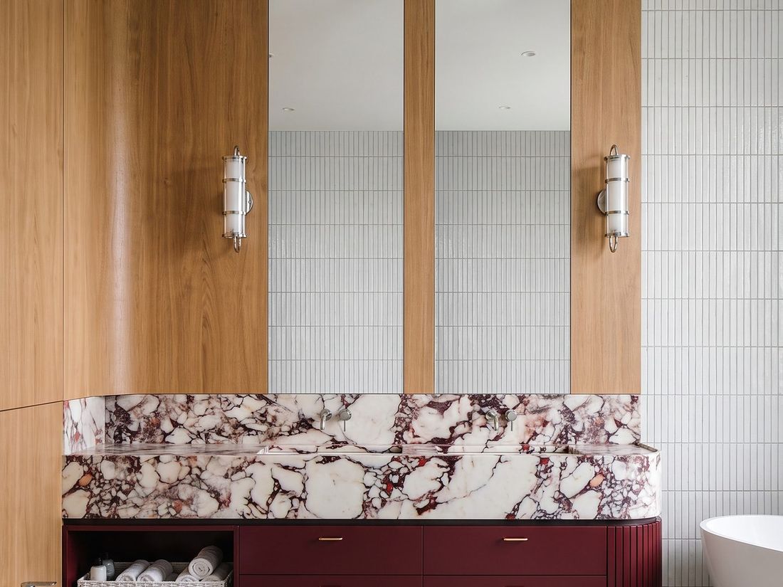 Marble vanity and twin mirrors in the master bathroom, Sky Villas
